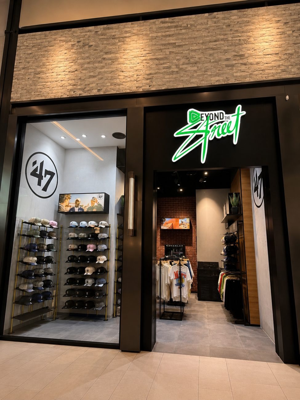 Beyond the Street storefront wide view with '47 cap wall and entrance, Dubai Hills Mall