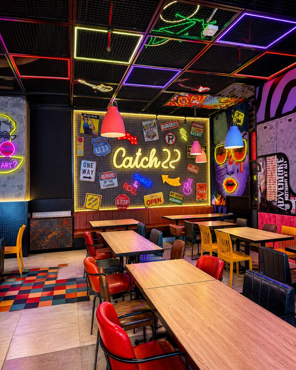 Catch 22 dining area with retro signage wall and colourful seating, Mirdiff City Centre