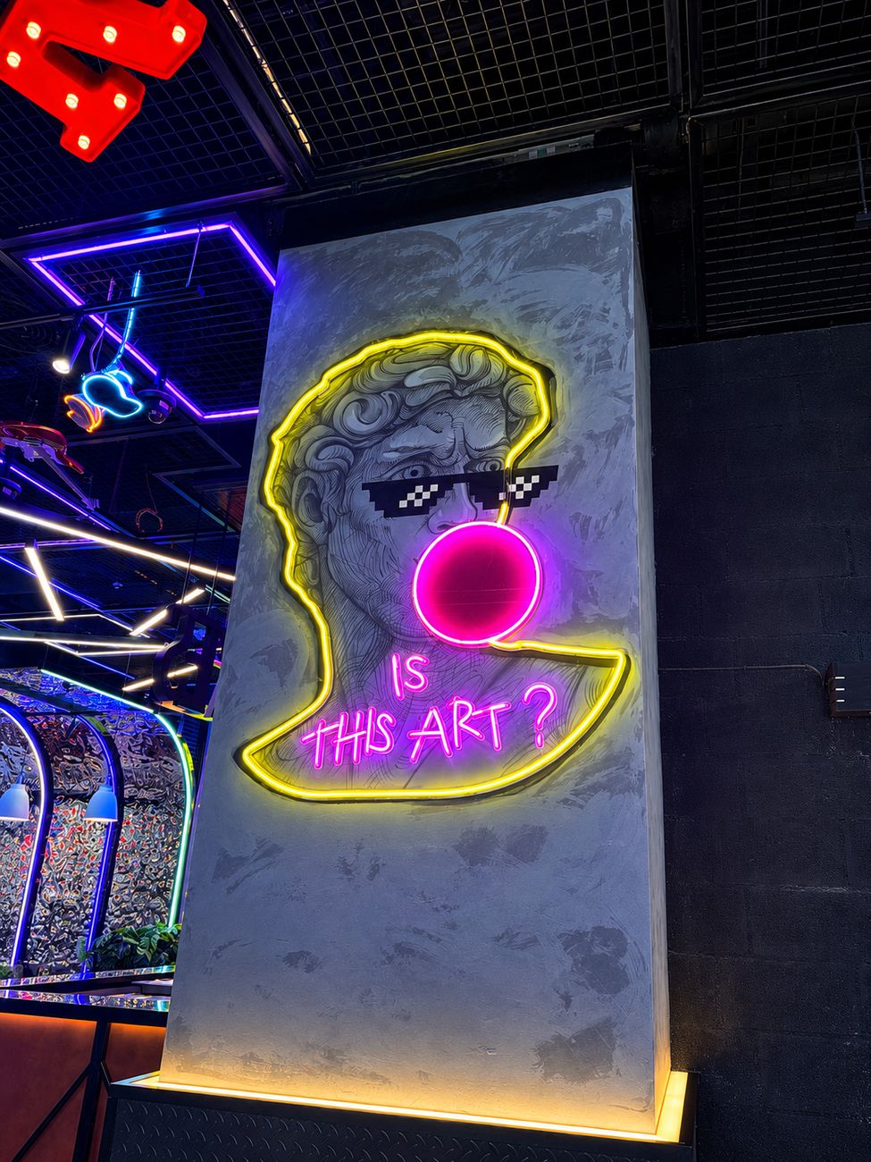 Catch 22 Is This Art neon sculpture feature wall, Mirdiff City Centre