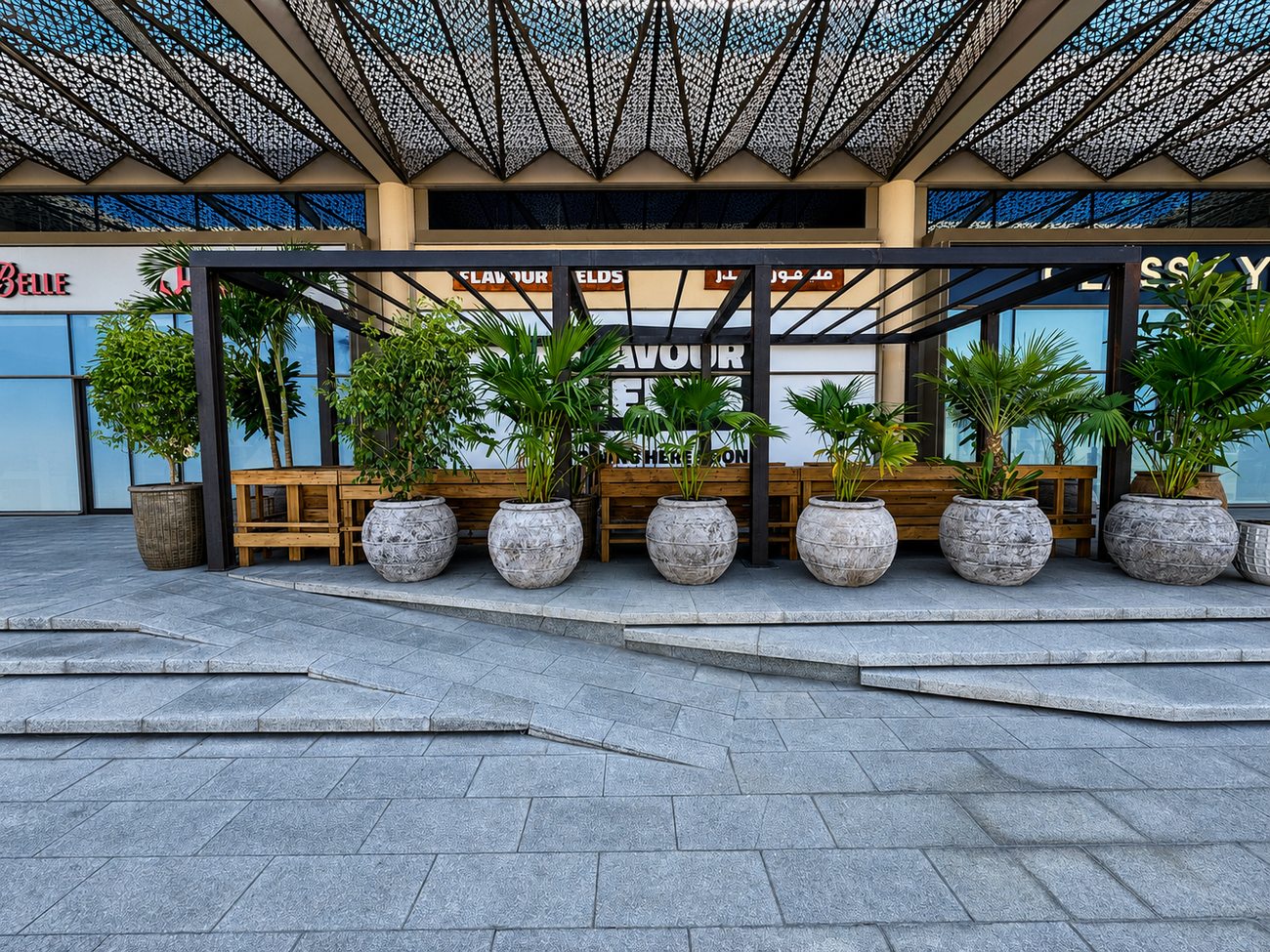 Flavour Fields exterior plaza with pergola canopy and potted palms, Dubai Galleria Mall, Jumeirah