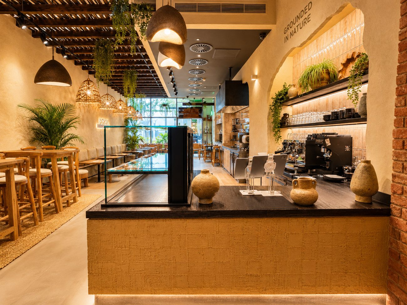 Flavour Fields order counter, second angle, with exposed brick pillar and dining beyond, Dubai Galleria Mall