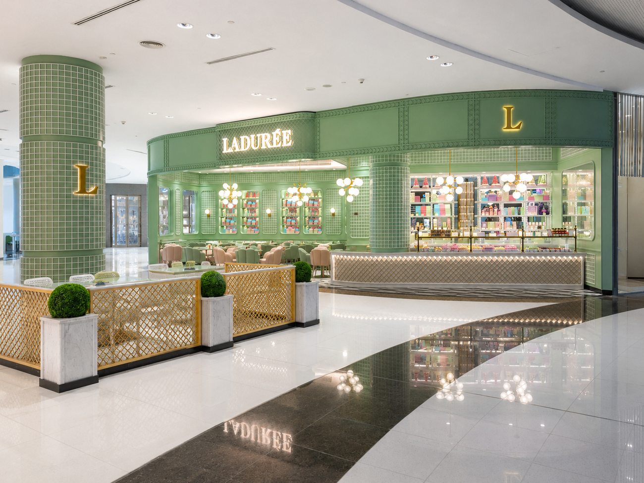 Laduree exterior terrace column and signage reflected in the mall floor, The Dubai Mall