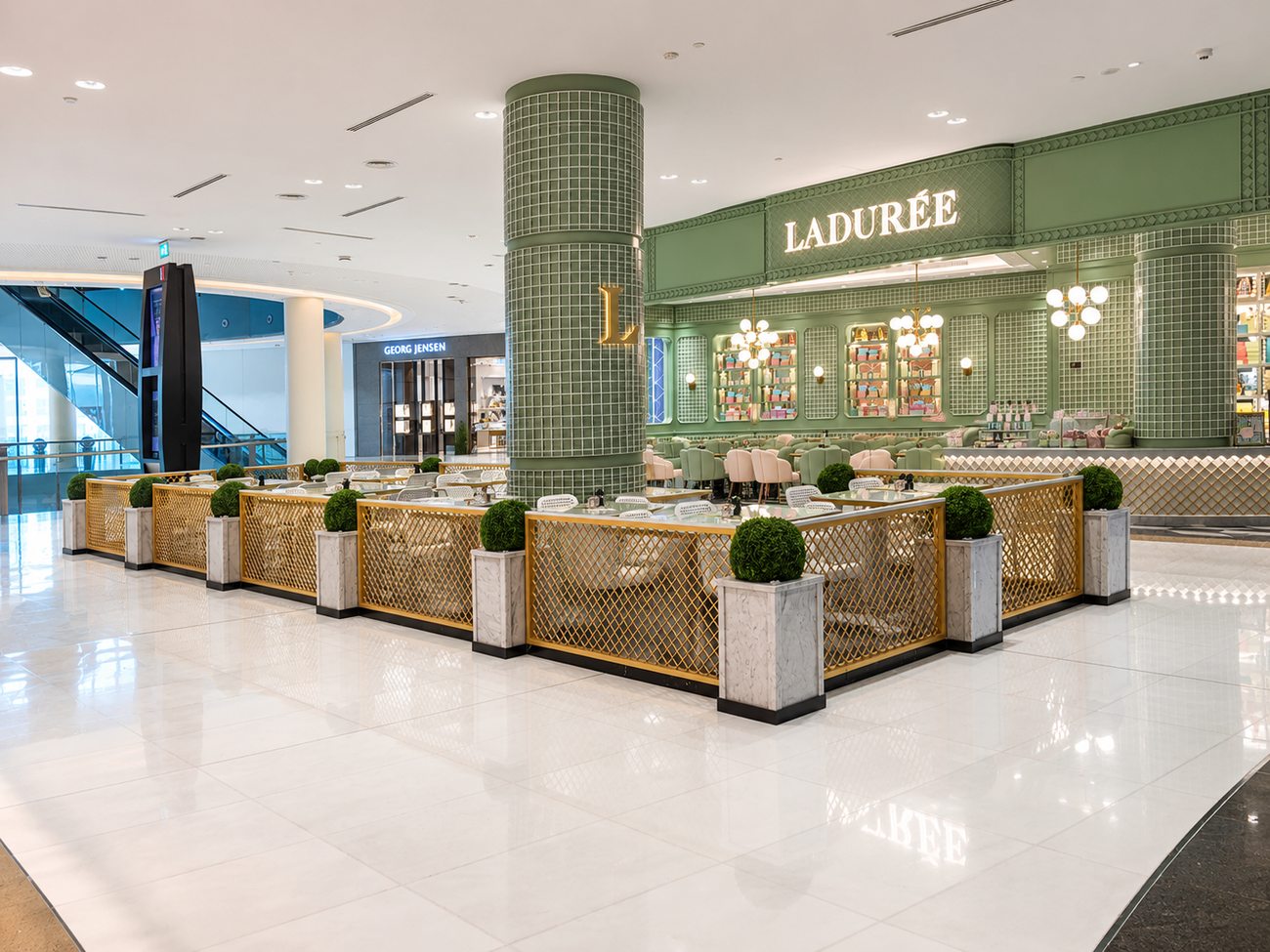 Laduree mall exterior wide view alongside neighbouring storefronts, The Dubai Mall