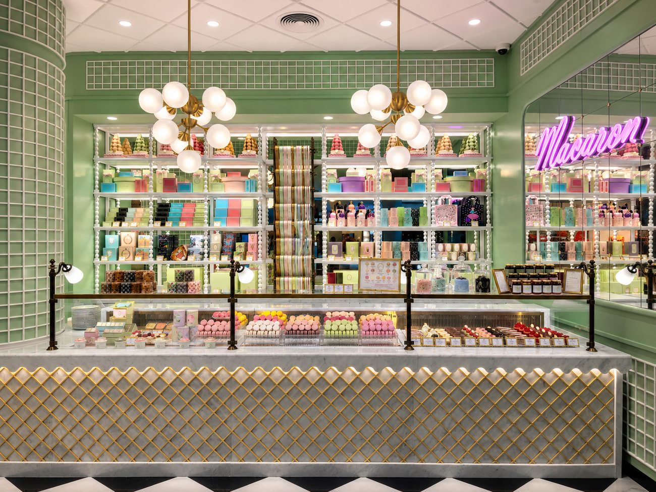 Laduree storefront counter wide view with Macaron neon sign, The Dubai Mall