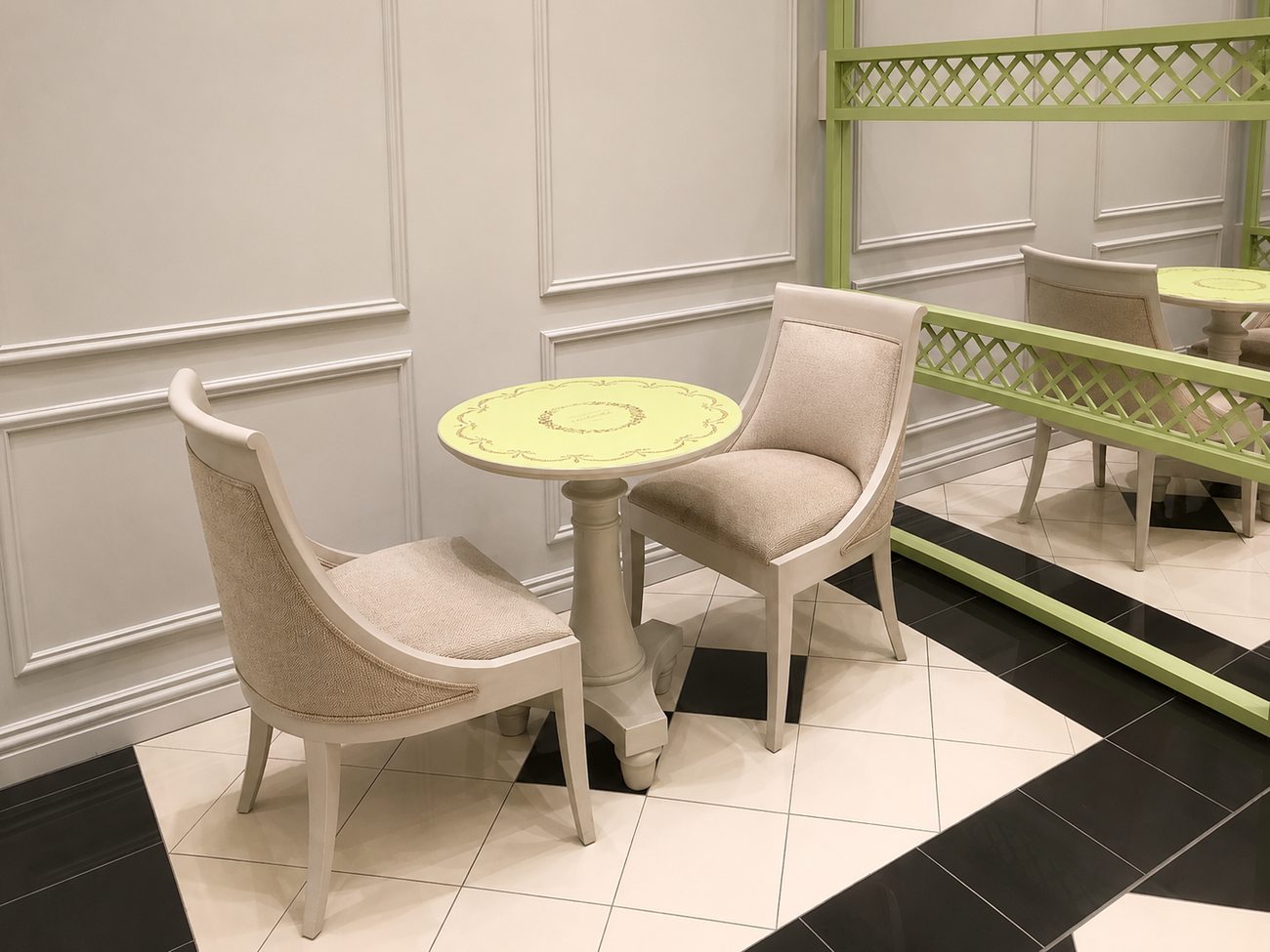 Laduree cafe table detail with branded tabletop, Mall of the Emirates