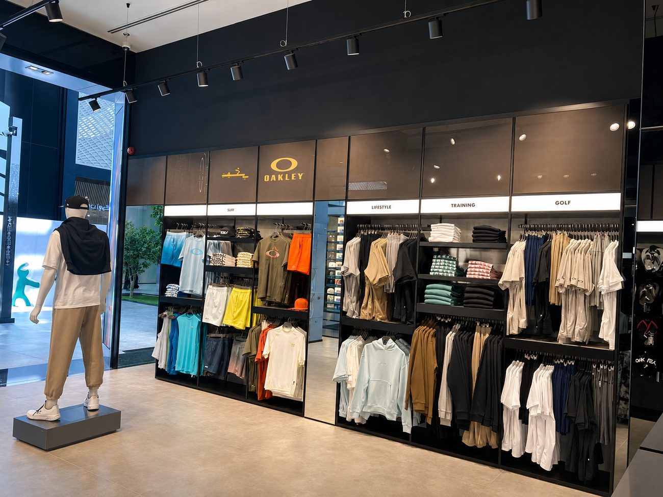 Oakley apparel wall with Surf, Lifestyle, Training and Golf category labels, Jeddah, Saudi Arabia