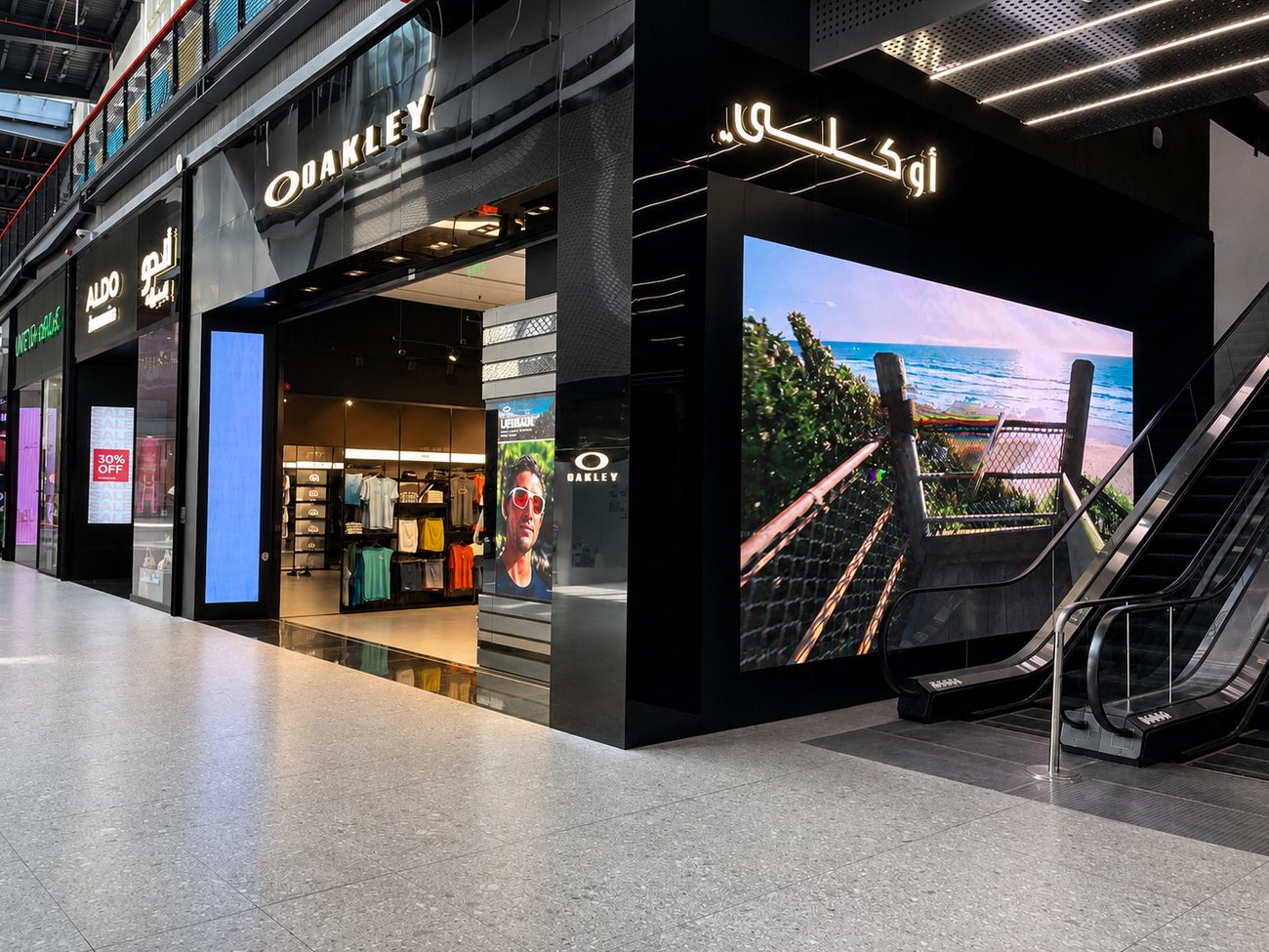 Oakley exterior storefront with Arabic signage and LED wall, Jeddah, Saudi Arabia