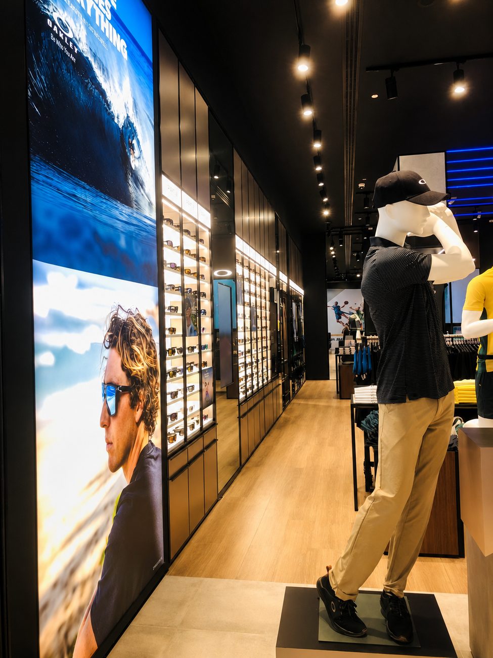 Oakley sunglasses wall corridor with mannequin display, Yas Mall, Abu Dhabi