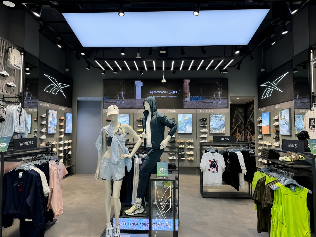 Reebok interior with ceiling lightbox and category walls, Mall of the Emirates