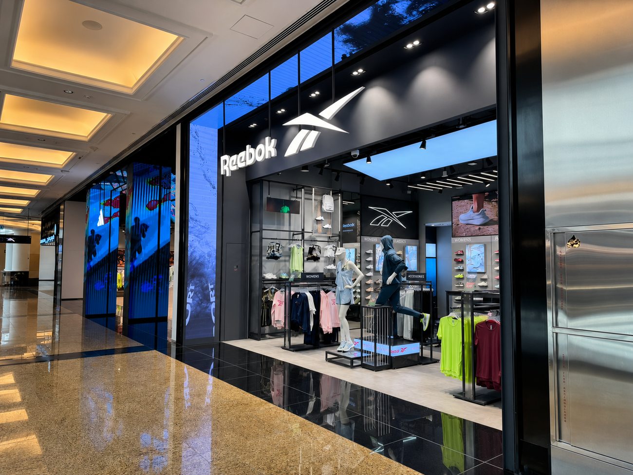 Reebok storefront wide view with LED media wall, Mall of the Emirates