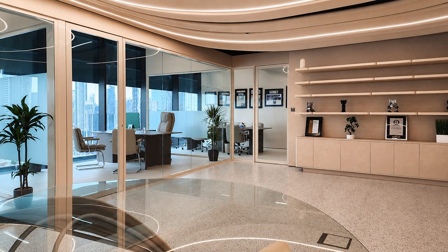 RIN Foundation Dubai office suites with glass partitions, bespoke shelving and city views by Davies Group UAE