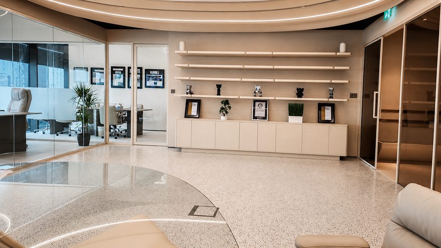 RIN Foundation open office with custom display wall joinery and awards, by Davies Group UAE