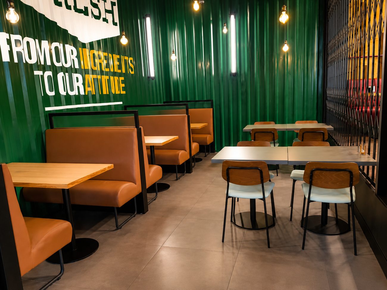 Roadster Diner green feature wall with booth seating, Mirdiff City Centre