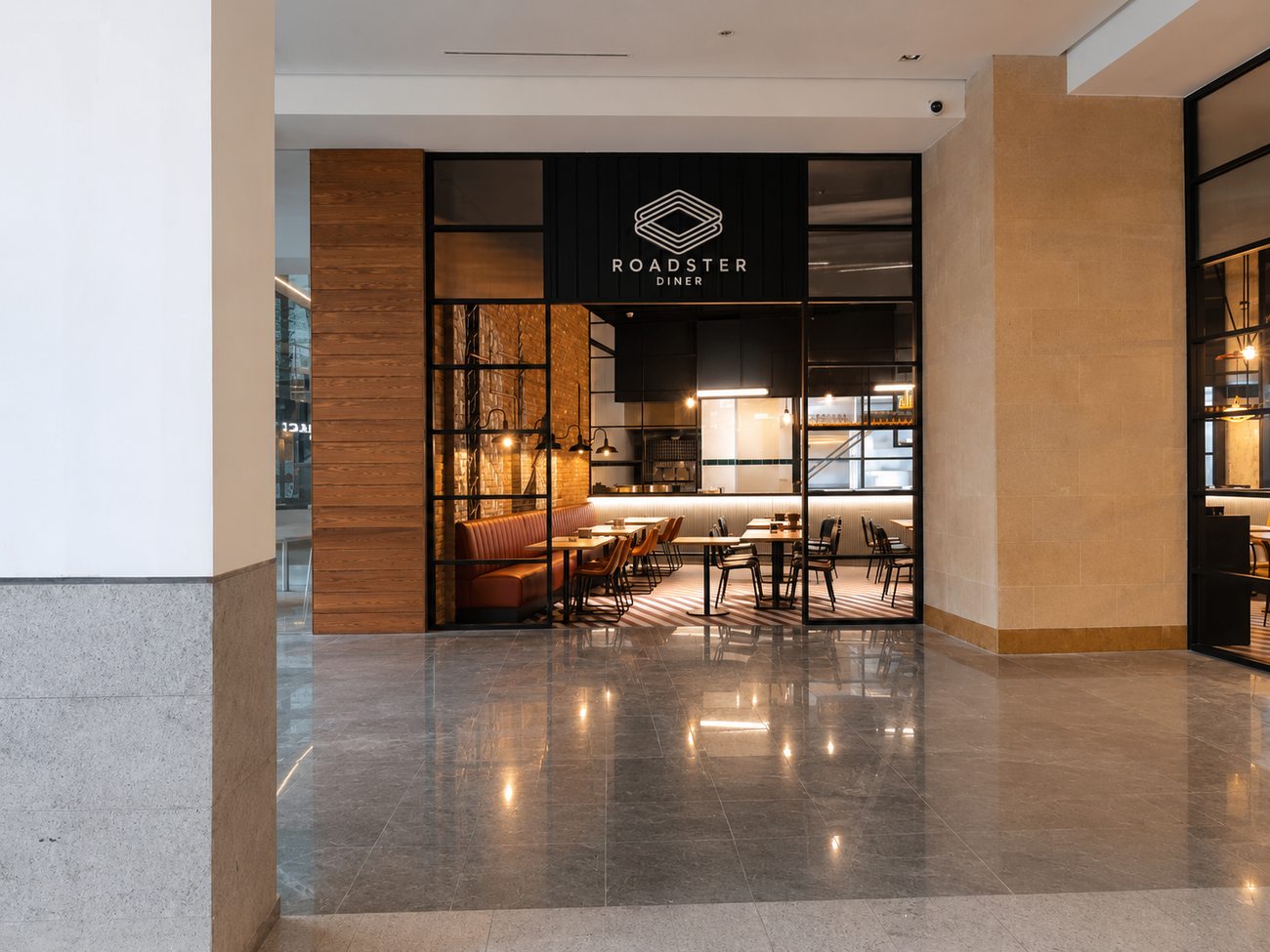 Roadster Diner storefront entrance viewed down the mall corridor, Mirdiff City Centre