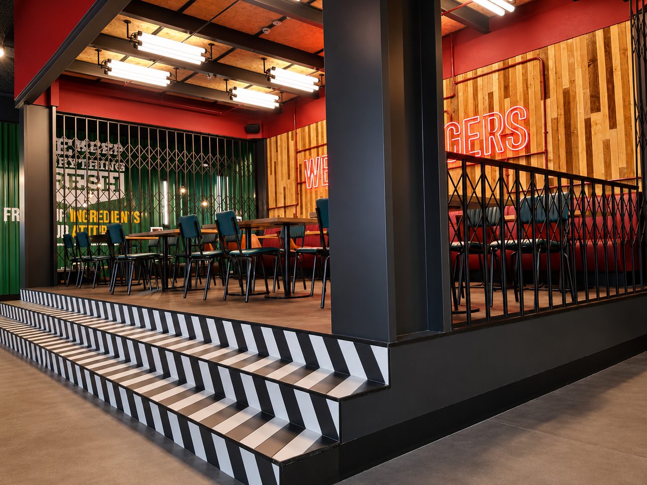 Roadster Diner striped steps beneath Burgers neon sign, Mirdiff City Centre