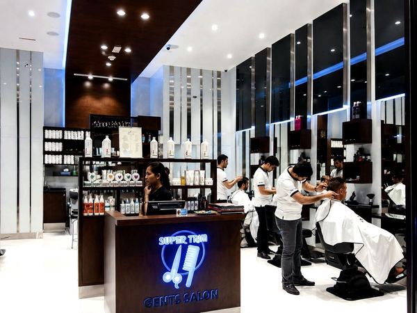 Super Trim Gent's Salon barbers at work by Davies Group UAE